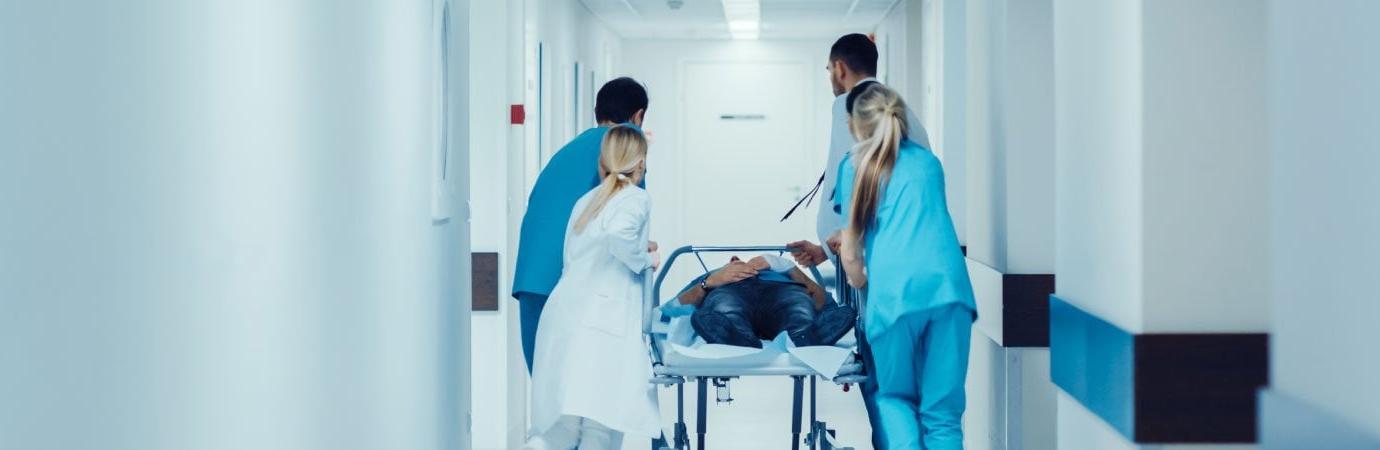 nurses and doctors with a patient